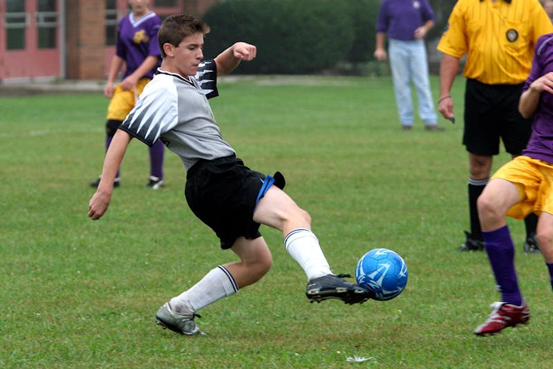 Kid playing football