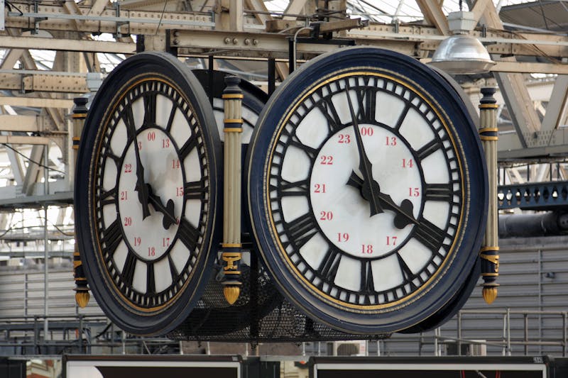 Clock face in train station that uses Roman numerals