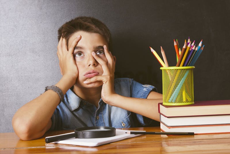 Boy looking worried about his schoolwork